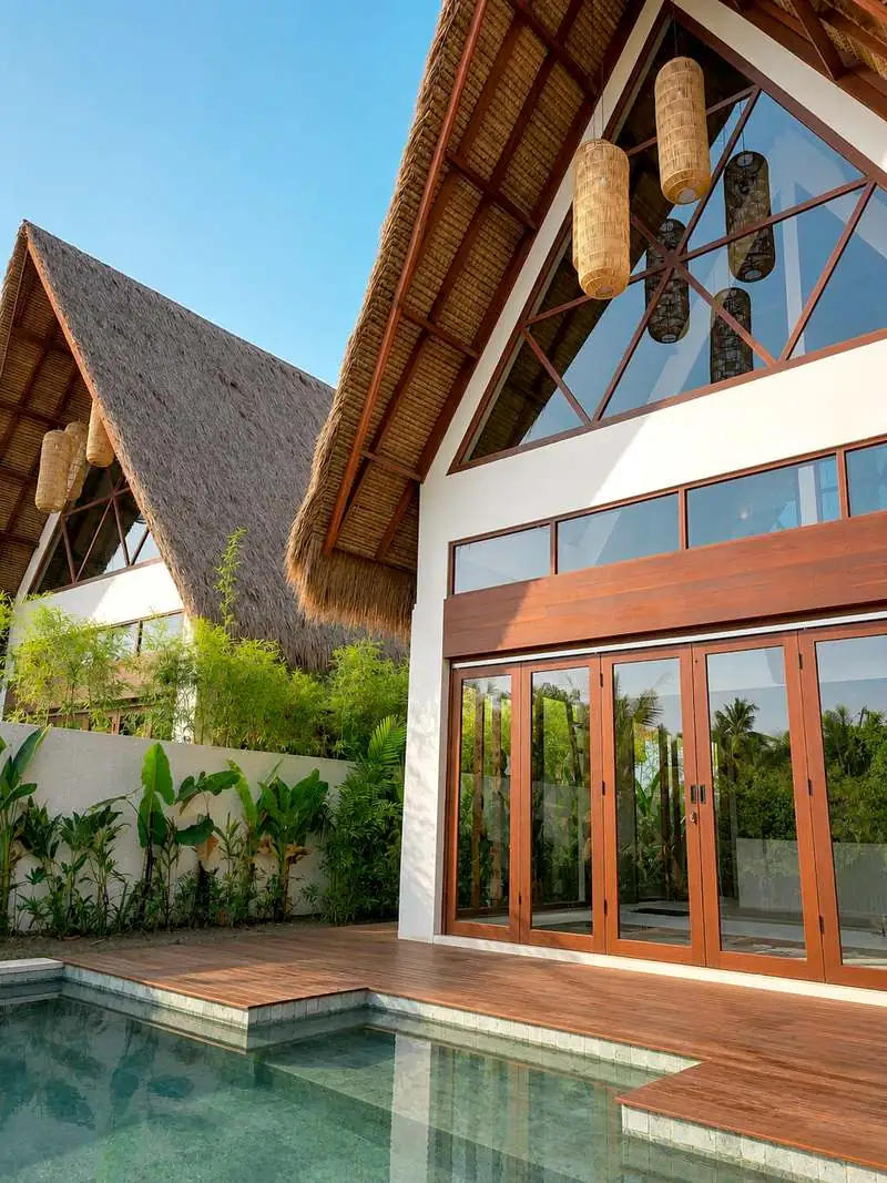 Private pool and teak deck beneath the thatched A-frame